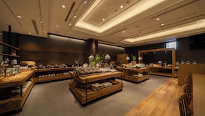 A modern restaurant interior with wooden tables and shelves displaying dishes. - Hotel Enoe Hakodate (Hakodate)