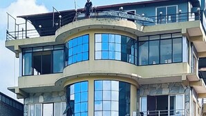 A multi-story hotel with balconies, large windows, and a sign reading 'HOTEL AUGUST INTERNATIONAL'. - Hotel August International (Pokhara)