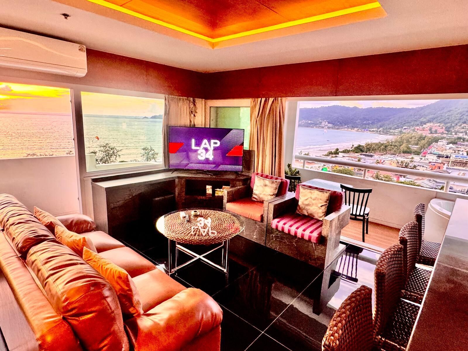 Appartamento, 2 camere da letto, vista mare | Area soggiorno | TV a schermo piatto