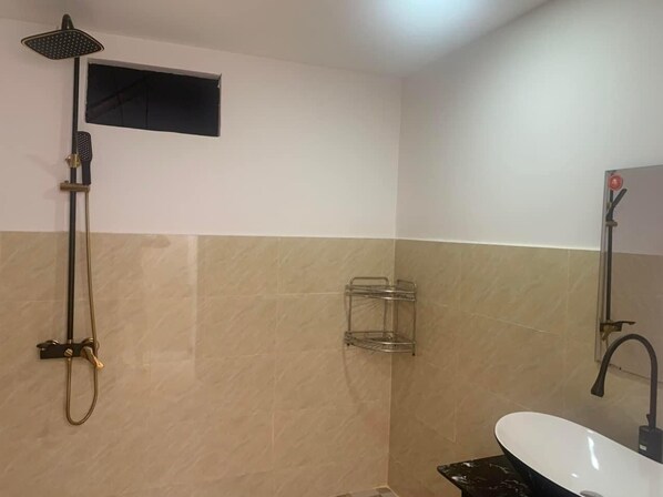 A bathroom with a shower, a sink, and a towel rack. - Motel Mys Dung as Motel Lavie (Tay Nha Trang)