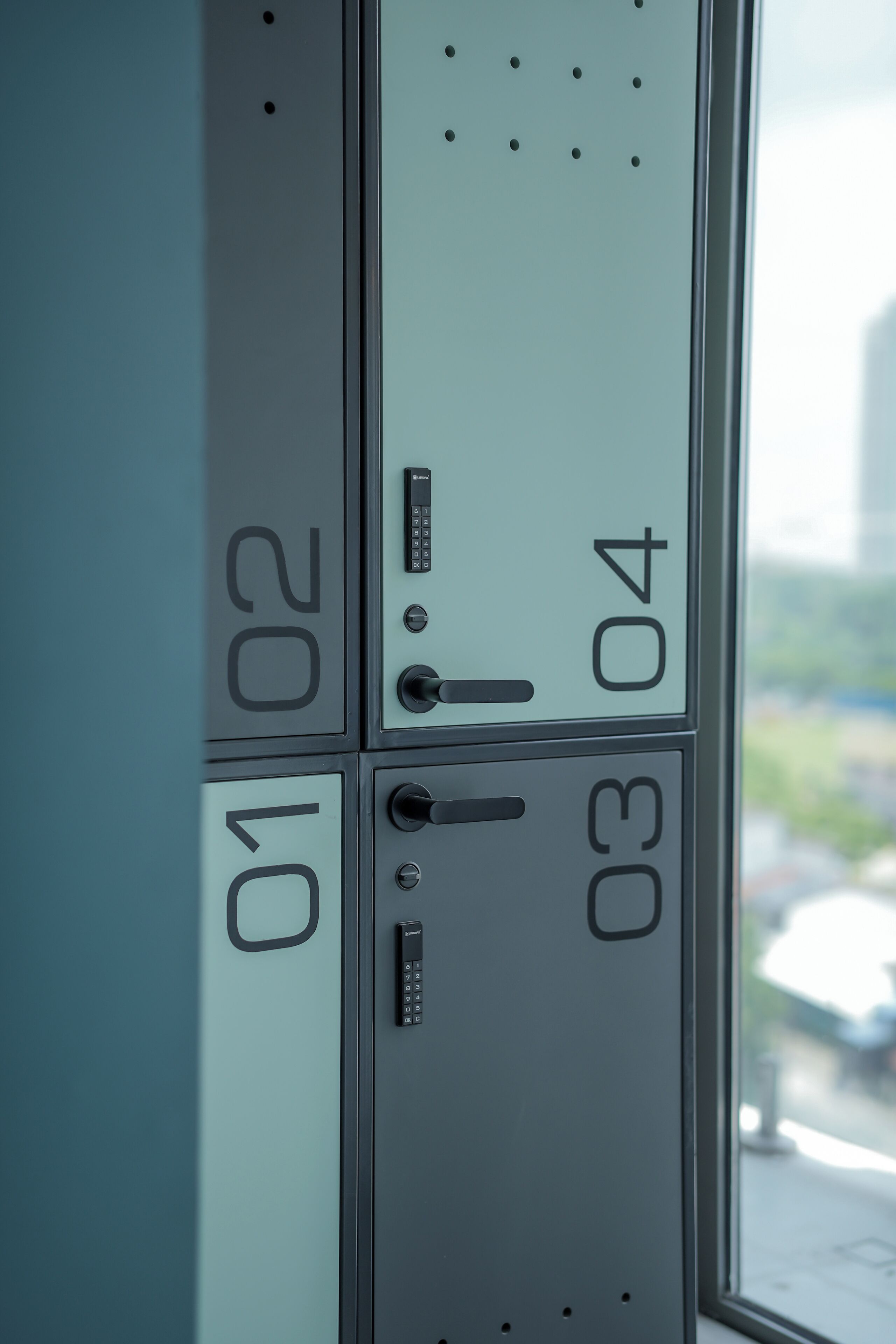 A close-up of a wall with numbered compartments, likely part of a hotel or office building.