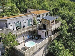 A modern multi-story house with a rooftop pool, large windows, and a balcony with outdoor seating. - 4 Star Holiday Home in Hisings Backa (Hisings Backa)