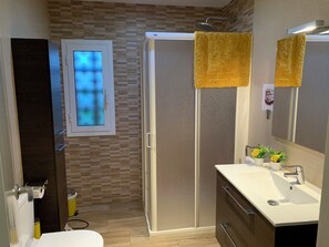 Shower, hair dryer, towels, soap