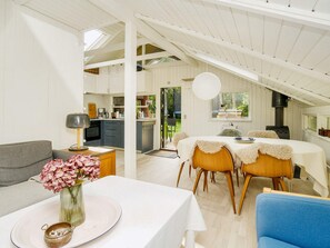 A cozy interior with a dining area, kitchen, and living space.