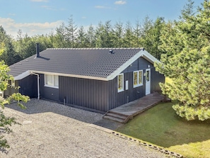 A modern two-story building with a dark exterior, a sloped roof, and a small front porch. - 4 Star Holiday Home in Logstor (Logstor)