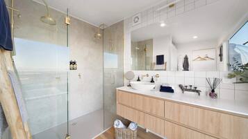 Shower, hair dryer, towels, shampoo