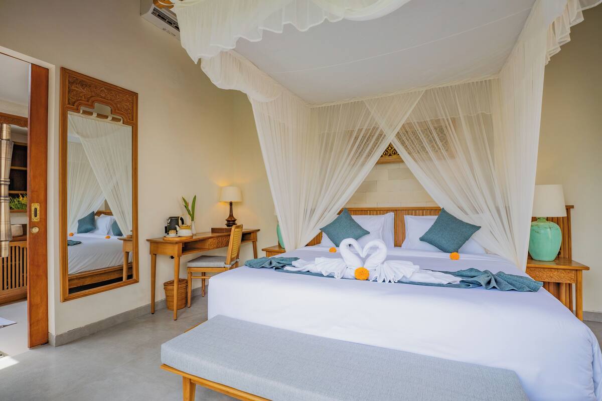 Premium bedding, desk, laptop workspace, soundproofing