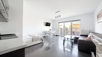 Apartament (20C) | Zona de estar | Una televisión de pantalla plana