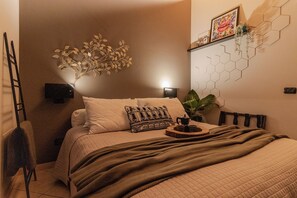 1 bedroom, desk, iron/ironing board, travel crib