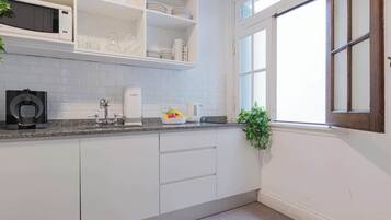 Microwave, coffee/tea maker, toaster, cookware/dishes/utensils