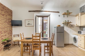 Family Apartment, Balcony | In-room dining