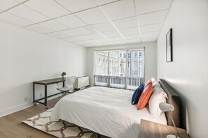 1 bedroom, desk, iron/ironing board, travel crib