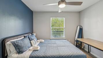 1 bedroom, desk, iron/ironing board, travel crib