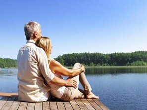 Relax on the dock overlooking the serene lake, perfect for a leisurely escape.