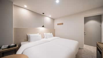 Twin Room, Multiple Beds, Non Smoking, Private Bathroom (Self Check-in) | Premium bedding, desk, laptop workspace, blackout drapes