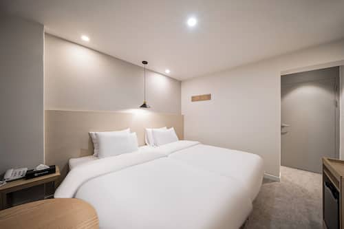 Twin Room, Multiple Beds, Non Smoking, Private Bathroom (Self Check-in) | Premium bedding, desk, laptop workspace, blackout drapes