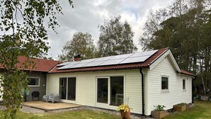 A single-story house with a red-tiled roof, a covered patio, and a small garden area. - 4 Star Holiday Home in Mellbystrand (Mellbystrand)