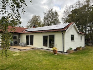 A single-story house with a red-tiled roof, a covered patio, and a small garden area. - 4 Star Holiday Home in Mellbystrand (Mellbystrand)