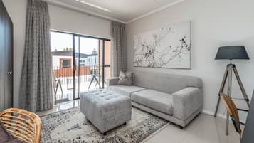 Apartamento, 2 quartos | Área de estar