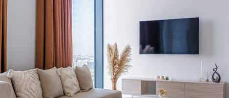 Apartment, City View | Living area | Flat-screen TV