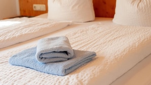 A hotel room with two beds, each with white bedding and pillows. - Apartment Near the Centre and ski Resort (Gaschurn)