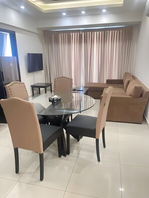 Standard Apartment | Living area | 45-inch LED TV with cable channels - Elysium Suites (Islamabad)