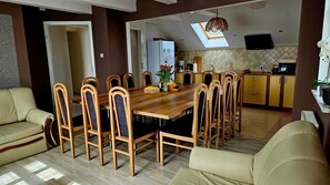 Enjoy family meals and gatherings in this spacious dining area with a large table and comfortable seating.