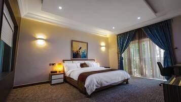 Deluxe Room, Balcony, City View | Desk, laptop workspace, free WiFi