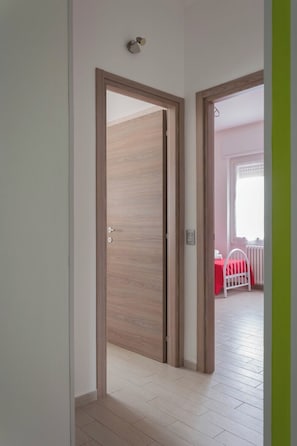 1 bedroom, desk, iron/ironing board, travel crib