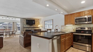 A modern kitchen with a dishwasher, oven, and microwave. - Be306b Bridge End 1br 1ba 2 Bedroom Condo (Copper Mountain)