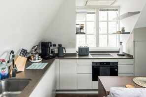 Classic Apartment, Balcony | Private kitchen | Electric kettle
