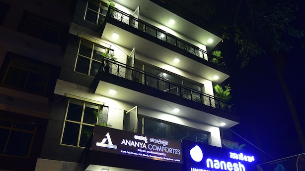 A multi-story building with a sign for 'Ananya Comforts' and 'Nanesh Unisex Beauty Salon & Spa'. - ANANYA COMFORTSS-OPP RAHEJA RESIDENCY  (Bengaluru)