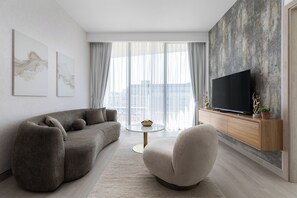 Deluxe Apartment, Balcony, City View | Living area - Waves - Urban Chic 1BR Apt With Maid (Dubai)