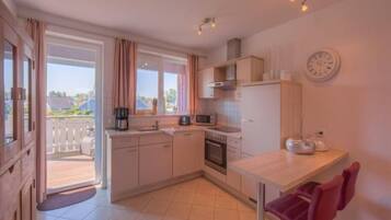 Apartment | Private kitchen | Electric kettle, toaster, high chair