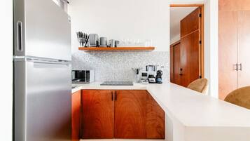 Fridge, microwave, stovetop, coffee/tea maker