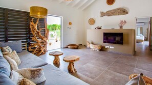 Deluxe Villa, Pool View | Living area | 45-inch Smart TV with digital channels, Netflix, streaming services - The Villas by LXRYHOME (Jan Thiel)