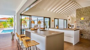Superior Villa, Pool View | Private kitchen | Fridge, microwave, oven, stovetop - The Villas by LXRYHOME (Jan Thiel)