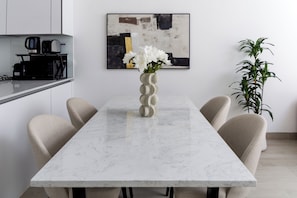 Deluxe Apartment, Balcony, City View | Dining room