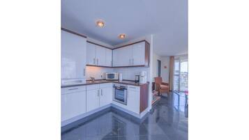 Apartment | Private kitchen | Electric kettle, toaster, high chair