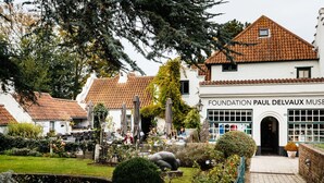 A building with a tiled roof and a sign reading "Foundation Paul Delvaux Museum". - Villa in Koksijde Near the Sea (Koksijde)