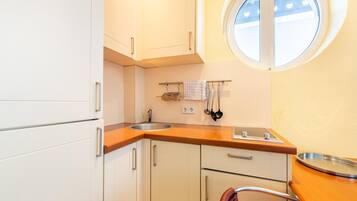 Apartment | Private kitchen | Electric kettle, toaster, high chair
