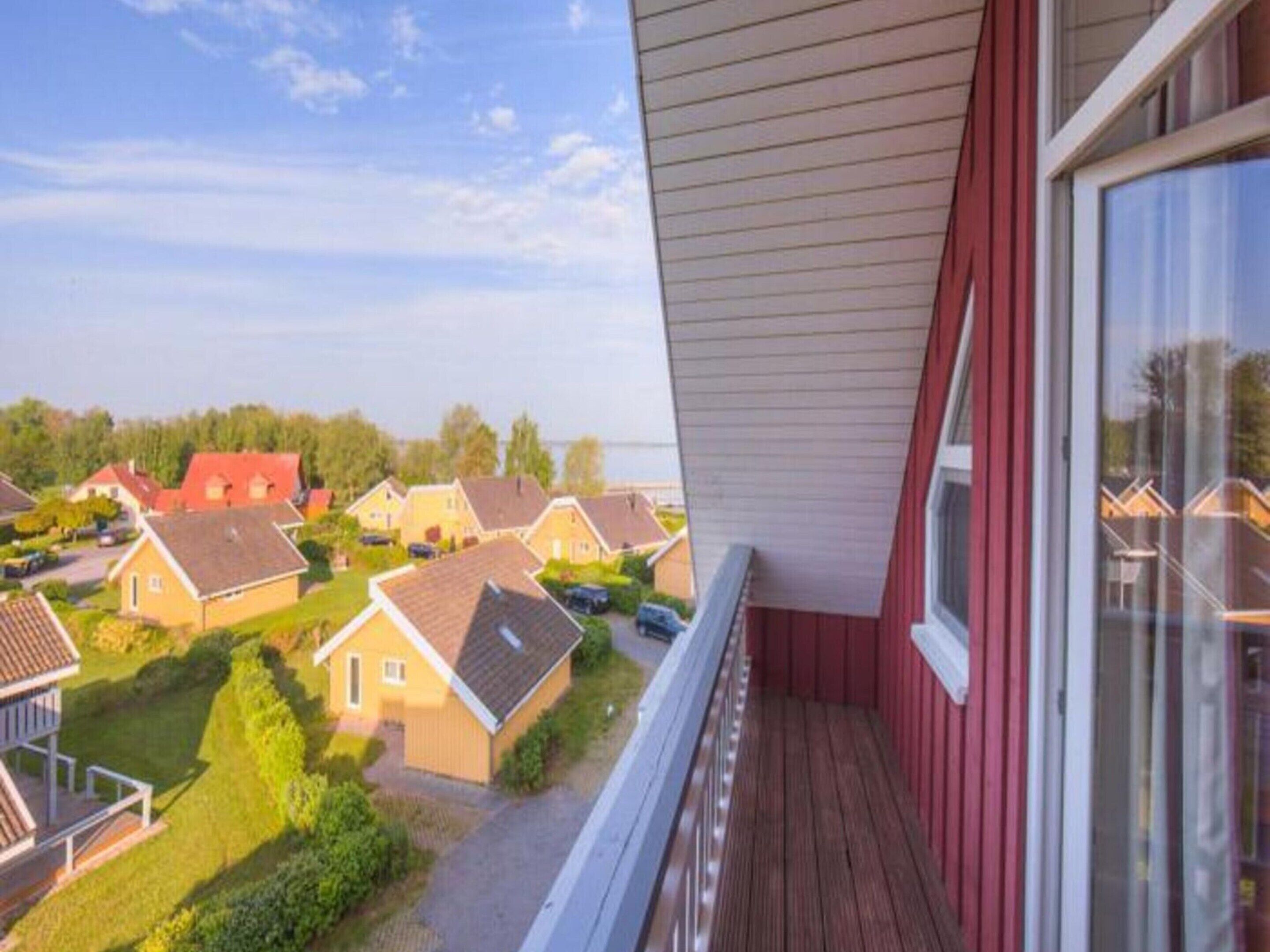 A residential area with houses and a view of the sea.
