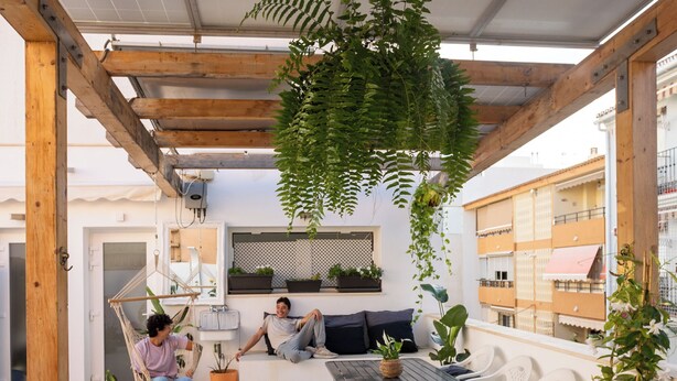 A rooftop patio with a hot tub, seating area, and hanging plants. - Villa Naim Guest House Cala del Moral (Rincon de la Victoria)