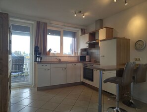 Apartment | Private kitchen | Electric kettle, toaster, highchair
