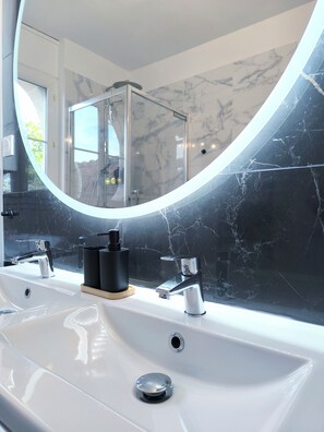Shower, hair dryer, towels, soap