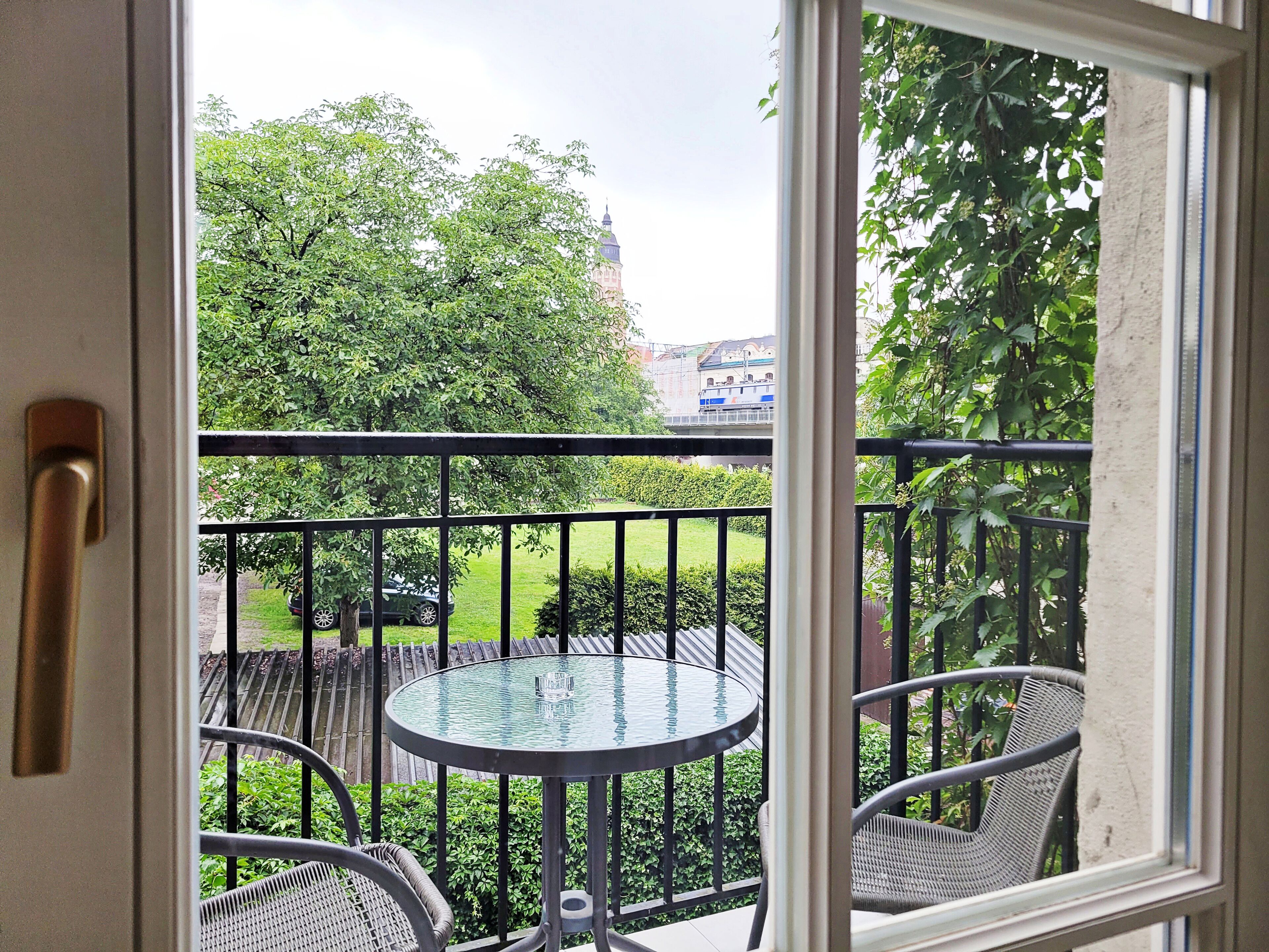 Classic Studio Suite, Courtyard View | In-room safe, desk, laptop workspace, iron/ironing board