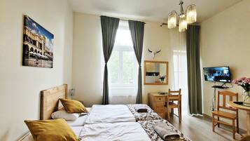 Standard Studio Suite, City View | In-room safe, desk, laptop workspace, iron/ironing board