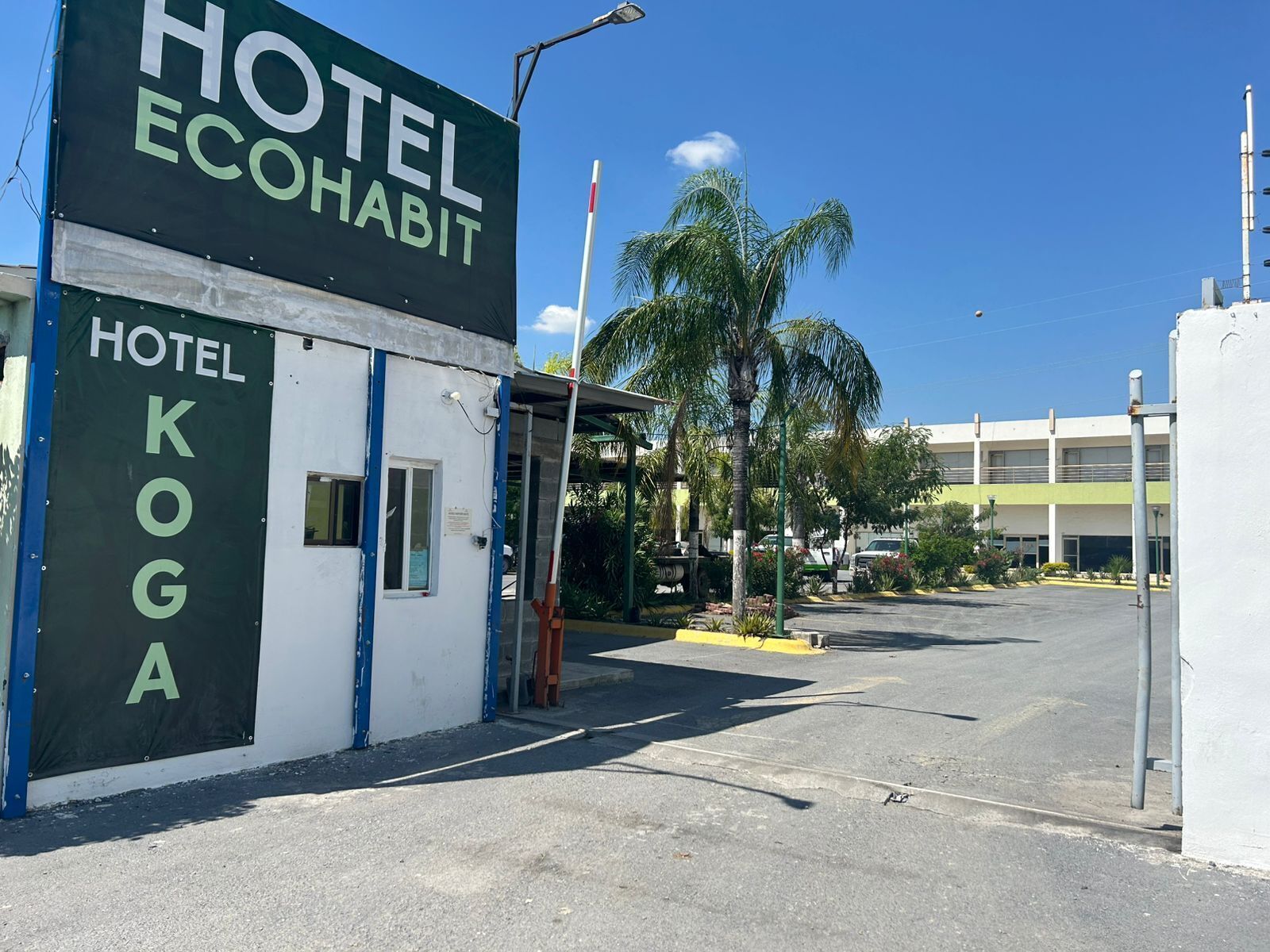 A hotel named 'Hotel Koga' with a sign indicating 'Hotel Ecohabit.'