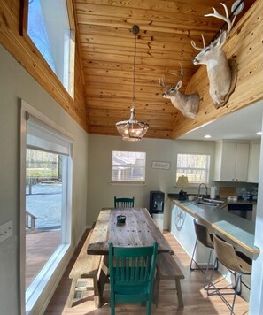 Enjoy meals in the dining area with a large table and comfortable chairs.