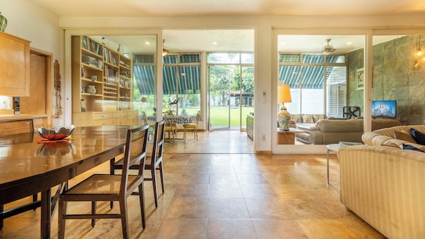 A spacious living area with a dining table, chairs, a sofa, and a TV. - Family-Friendly Oasis with Pool (Cuernavaca)
